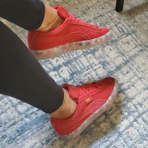 Pumas, red suede
